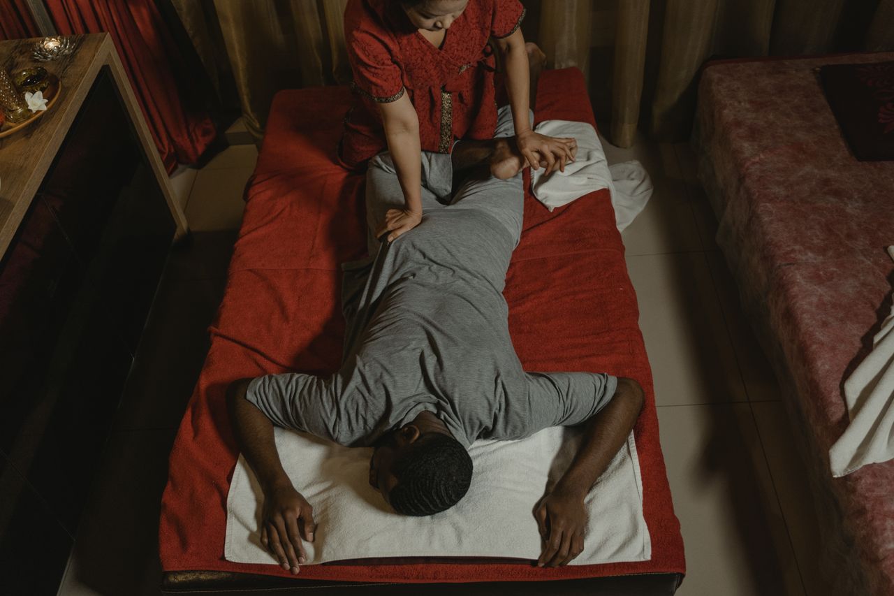 our-services-1 Relaxing Thai massage in a serene spa setting, enhancing wellness and relaxation.